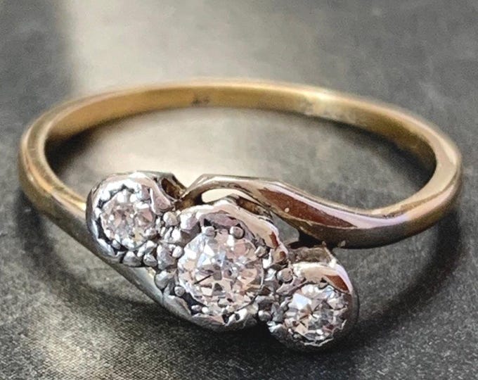 Diamond trilogy ring Antique 18ct Gold and platinum diamond bypass ring. Ring size L, size 5.5 US 2.1 grams natural old cut diamonds