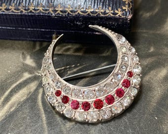 Victorian Silver Crescent Moon Brooch Pave set paste stones imitate rubies and diamonds circa late 1800s