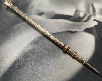 Antique chased gold gilt retractable pencil with plain onyx top ingalio