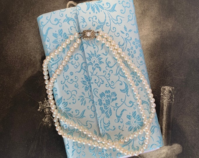 Mikimoto pearl necklace. Vintage Double strand 126 AAA quality 5.6mm akoya pearls. Original Mikimoto silk presentation purse and box