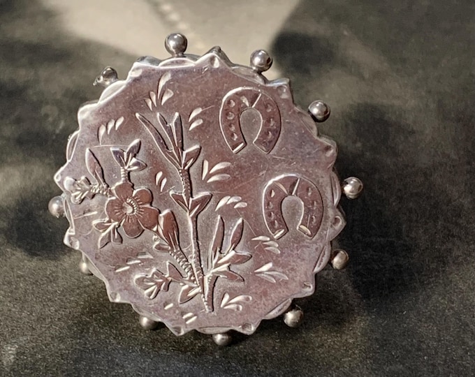 Forget me not brooch. Victorian Sterling silver Chester hallmark dates 1888-1889. Lucky horseshoe in 3.4 grams of silver