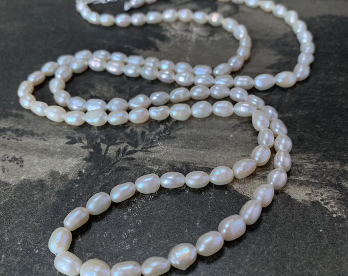 Custom Freshwater Pearl Necklace 5-6 mm with silver extension chain and findings 34 to 36 inches long. Opera length 86cm