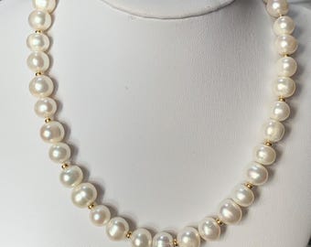 New 10mm baroque pearl necklace. 18ct gold clasp 46cm princess length with small gold beads Bright and glossy lustre 17inches long