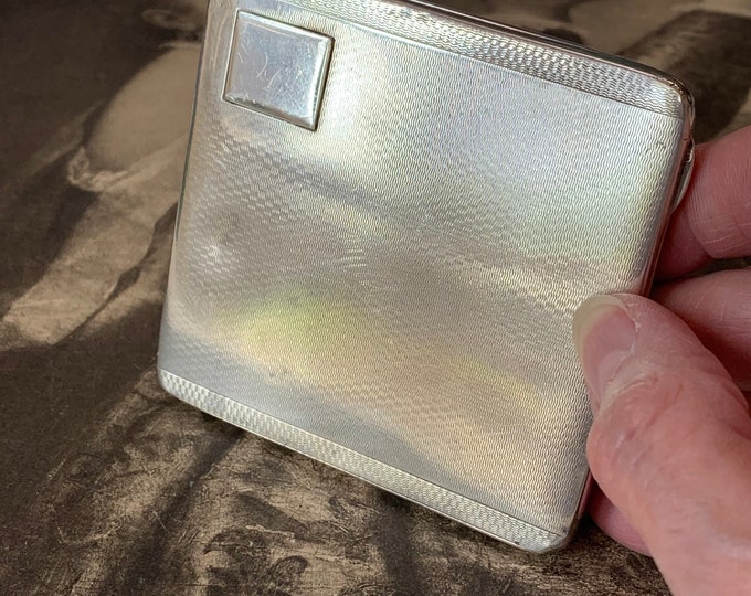 1930 Sterling Silver cigarette case. 109 grams of silver with Full Birmingham hallmarks. Gold gilt wash and machine engraving