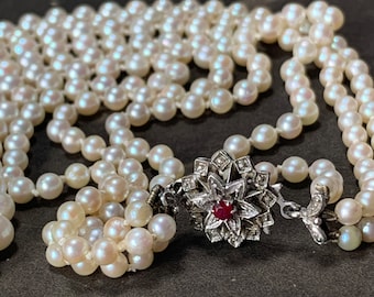 Vintage 3 strand Pearl Necklace: 18ct Gold Ruby Clasp, Graduated 3-Strand princess length necklace