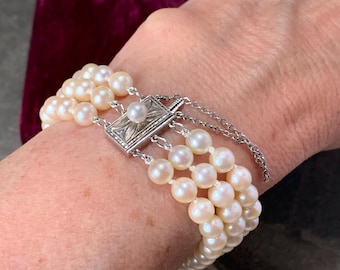 Vintage Mikimoto Pearl Bracelet.  3 strands of  84 5mm Akoya Pearls. Silver Clasp original velvet box