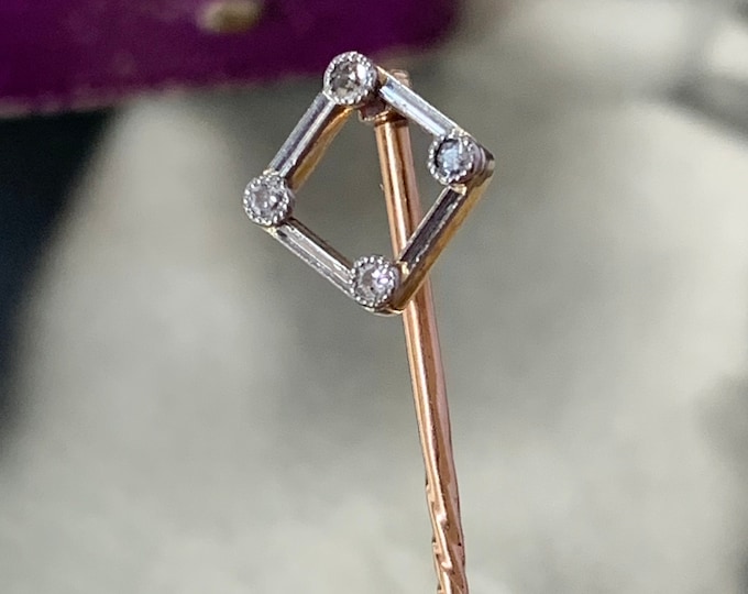 14k gold and platinum Art Deco diamond stick pin showcases the timeless beauty of four mine-cut diamonds