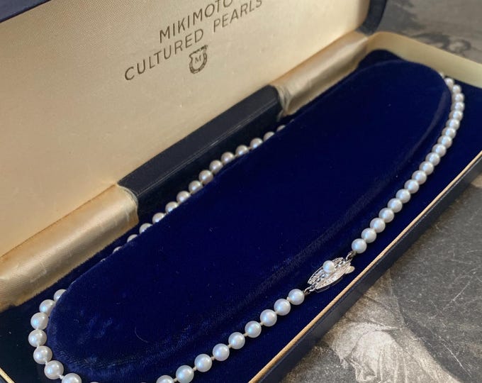 Mikimoto Akoya Pearl Necklace in Original Mikimoto Box. 1950s with silver clasp with Mikimoto stamps. Princess length