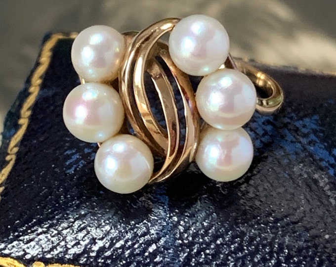 Mikimoto pearl ring. 14ct gold 4.3 grams. 6 Akoya 6mm pearls. Ring size Q or a US 8. 4.3