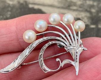Vintage Mikimoto pearl brooch. 5mm gem quality akoya pearls in a beautiful silver floral spray design