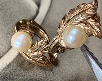 Vintage Mikimoto gold earrings 8mm AAA akoya pearls. 1978 London hallmark. Clip on earrings in a floral design