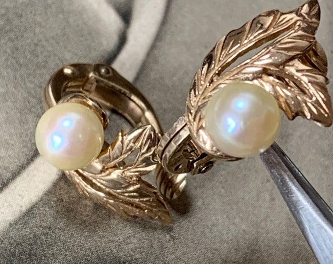Vintage Mikimoto gold earrings 8mm AAA akoya pearls. 1978 London hallmark. Clip on earrings in a floral design