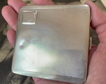 Sterling Silver cigarette case. 109 grams of silver with 1930 Birmingham hallmarks. Gold gilt wash and machine engraving