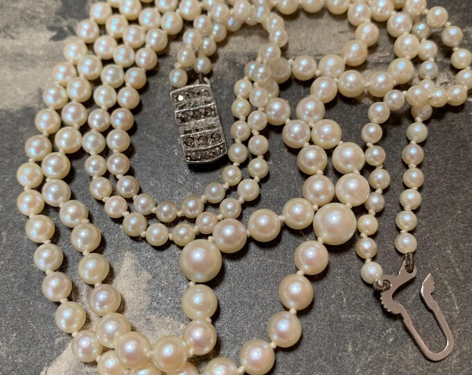 Double strand pearl necklace. 198 vintage cultured pearls 3.5mm-7mm.  21 inches matinee length with a Silver marcasite set clasp