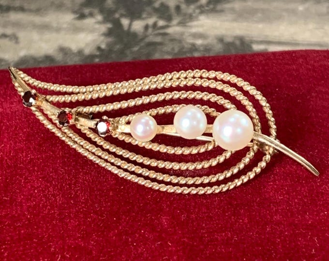 1960s Mikimoto 9ct Gold Pearl brooch. Garnets and pearls in a leaf design  with vintage Mikimoto Box. London hallmarks