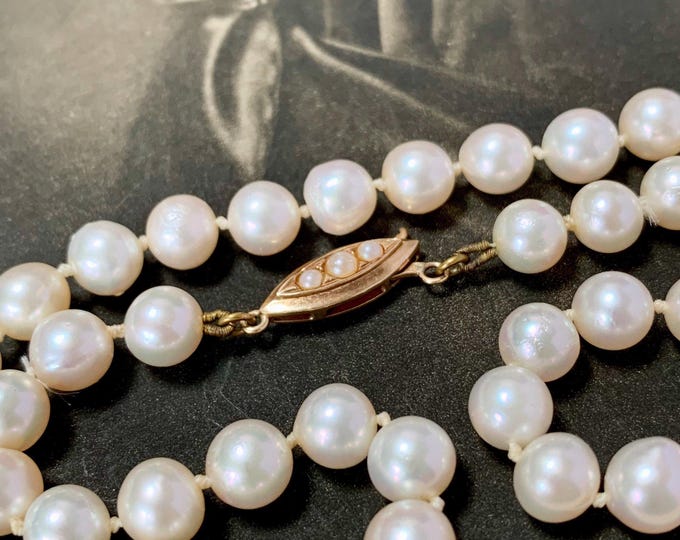 Pearl Necklace: 9ct Gold Clasp, 1979 English Hallmark. strand of 7mm akoya pearls