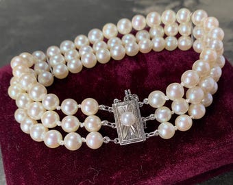 Mikimoto 3 strand pearl bracelet. 17cm long 5.5mm akoya pearls with silver clasp and Mikimoto velvet box. Beautiful