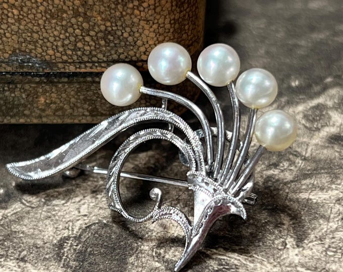 Vintage Mikimoto brooch with five high-grade AAA Akoya pearls in a Silver cornucopia bouquet
