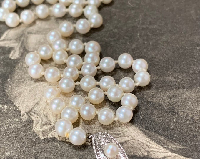 5mm Akoya pearl Mikimoto necklace. Princess length 18 inches with silver and pearl set clasp