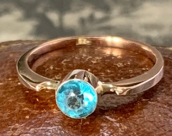 Vintage gold ring set with a blue paste stone. ring size J (UK)
