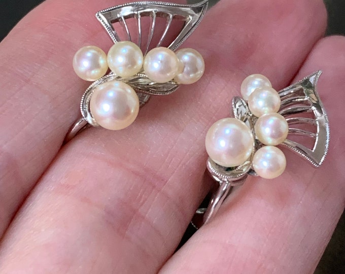 Mikimoto silver akoya pearl earrings. 4mm-6mm akoya pearls. Butterfly design in silver with screw back fittings