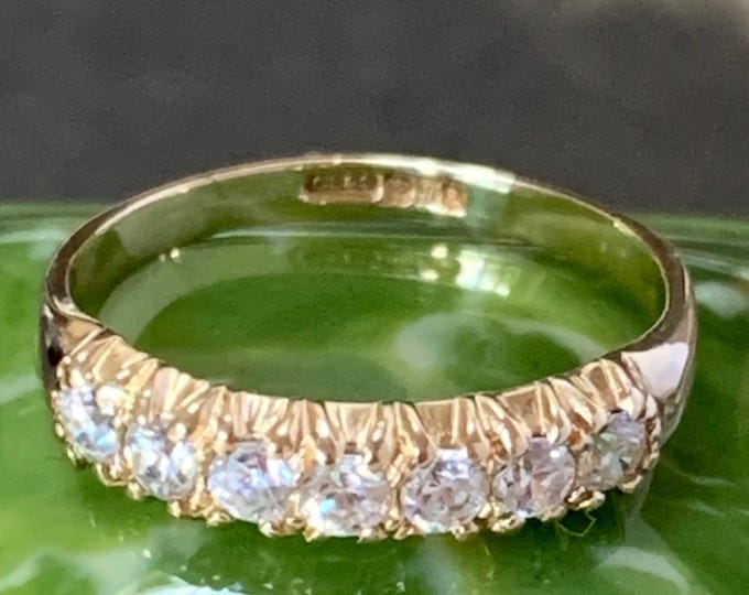 9ct Gold eternity ring. Ring size K1/2, size 5 3/8 US. Cubic zirconia gemstones beautifully set in a gold band. Hallmarked