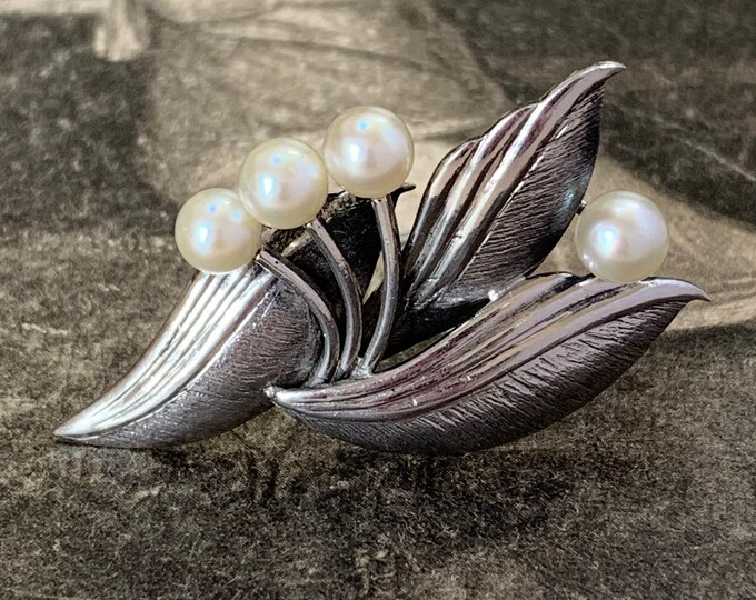 Mikimoto Akoya Pearl Brooch. Sterling silver cultured pearls in a floral spray