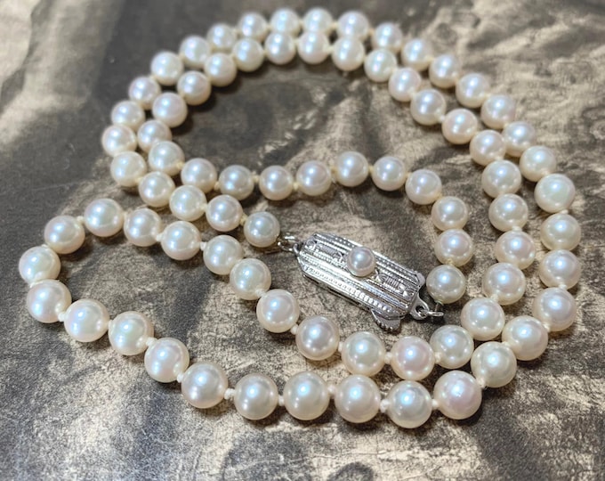 Mikimoto 19 inch Pearl Necklace.  Princess length akoya pearl necklace with silver and pearl clasp