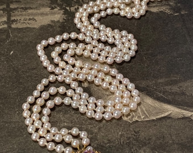 3 Strand Akoya pearl necklace. 1988 vintage London hallmark. 207 pearls Princess length with 9ct gold amethyst and pearl clasp