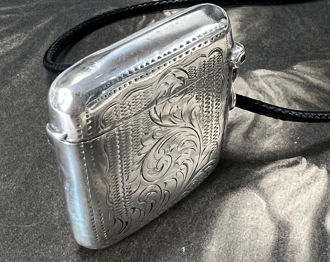 Solid Silver vesta case pendant dates 1904, 24.5 grams. Ornately engraved Edwardian case