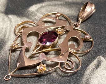 Art Deco pink tourmaline pendant with gold floral motifs. Hand made in 9ct yelow gold this would make a wonderful keepsake gift