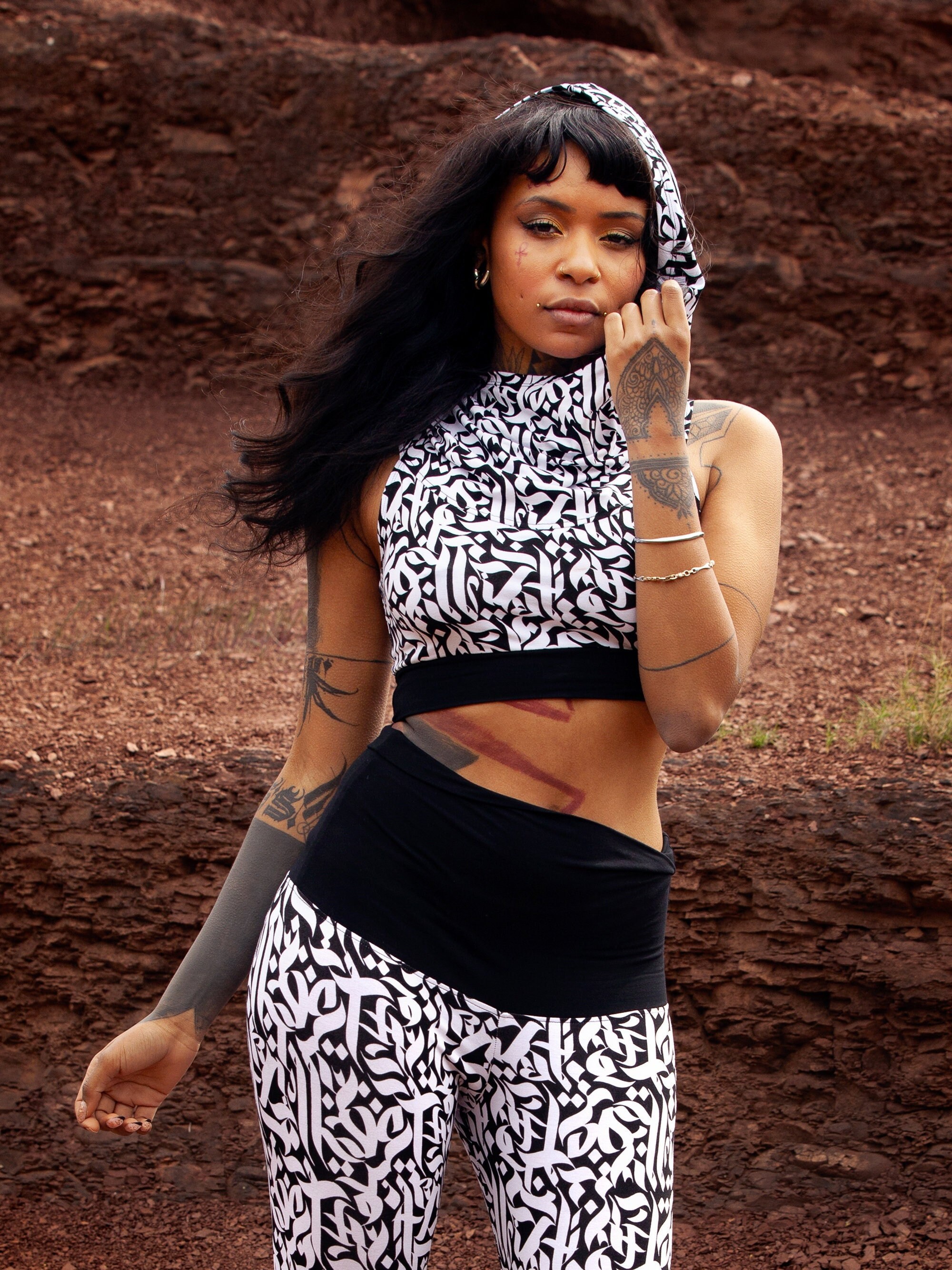 Black and white hooded crop top with cowl neck in viscose jersey with black calligraphy print, EKINOX KALAM White by BLACKBOHEM