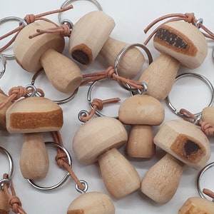 Mushroom pendant keychain in mushroom shape in 2 different sizes carved from raw wood with bark also as a pocket charm