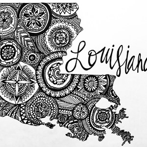 May include: Black and white line art illustration of the state of Louisiana with intricate mandala designs. The word "Louisiana" is written in cursive script.