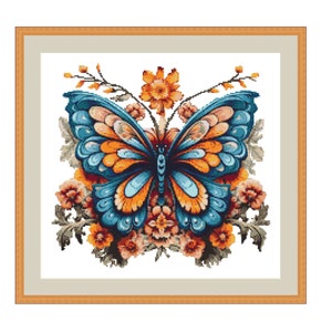 May include: A blue and orange butterfly with intricate details is surrounded by a floral arrangement of orange, yellow, and pink flowers. The butterfly is centered in the image and the flowers are arranged around it.