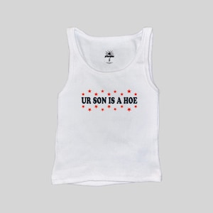 May include: White ribbed vest top featuring the navy blue text "UR SON IS A HOE" with red star accents. A small logo is visible near the neckline, and the size is indicated as "S".