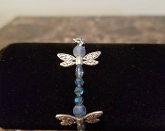 Dragonfly in blue smoke