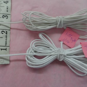 May include: Two spools of white elastic cord. The smaller spool is 1 1/16 yards and the larger spool is 3.0 yards.
