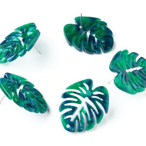 May include: Four pairs of green and blue tropical leaf shaped earrings with silver posts.