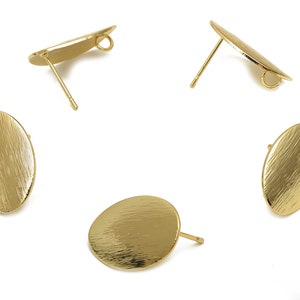 May include: Four gold-toned oval earring blanks with a brushed finish. Each blank has a post and a loop for attaching findings.