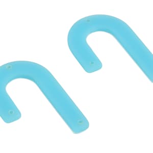 May include: Two light blue, U-shaped acrylic earring components. Each component has a curved top and a straight bottom with two small holes for attaching earring hardware. The earrings are a solid, opaque color.