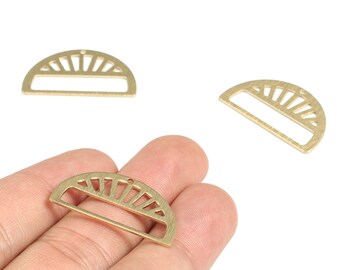 May include: Gold-colored metal half-circle charms with a sunburst design. Each charm has a rectangular opening in the center and a small hole at the top for stringing. These charms are ideal for jewelry making and crafting.