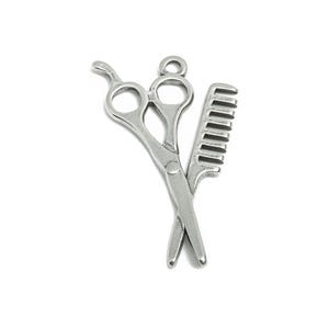 May include: Silver-toned charm featuring a pair of scissors and a comb, a common symbol for hair salons and barbershops.