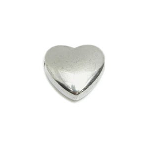 May include: A silver heart-shaped charm with a smooth, shiny finish.
