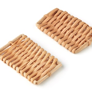 May include: Two rectangular woven wicker trays, made of natural light brown material, are displayed on a white background.