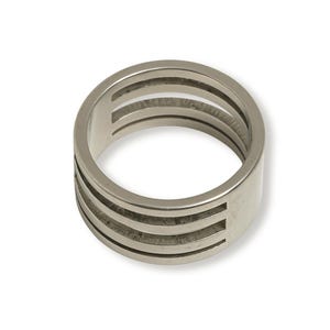 May include: A silver-colored ring with a wide band and four horizontal cut-out sections. The ring is made of a shiny, metallic material and is set against a white background. This ring is a piece of jewelry.