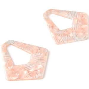 May include: A pair of pink and white geometric earrings with a marbled pattern.