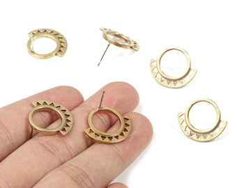 May include: Gold-colored earrings with a geometric design. The earrings feature a circular stud with a half-circle pendant. The pendant has a series of triangular cutouts along the edge. The earrings are displayed on a white background.
