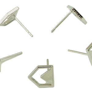 May include: Four pairs of silver geometric stud earrings. Each earring features a different geometric shape with a hollow center.