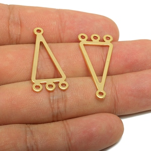 May include: Two gold-colored metal jewelry connectors. One is a triangle with three small loops at the bottom and a single loop at the top. The other is a triangle with three loops at the top and a single loop at the bottom.